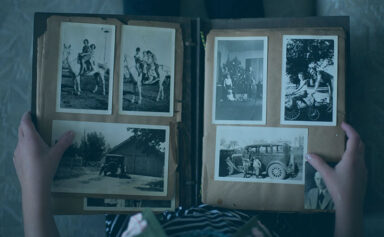 A scrapbook from perhaps 1950 being held on a person's lap