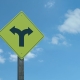 A road sign indicating a branching of the road