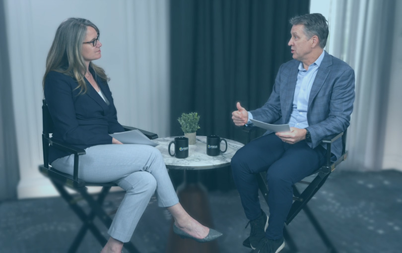 Photo of Alice Burley and Lane MacDonald sitting and speaking
