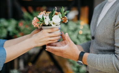 People Holding a Flower Pot