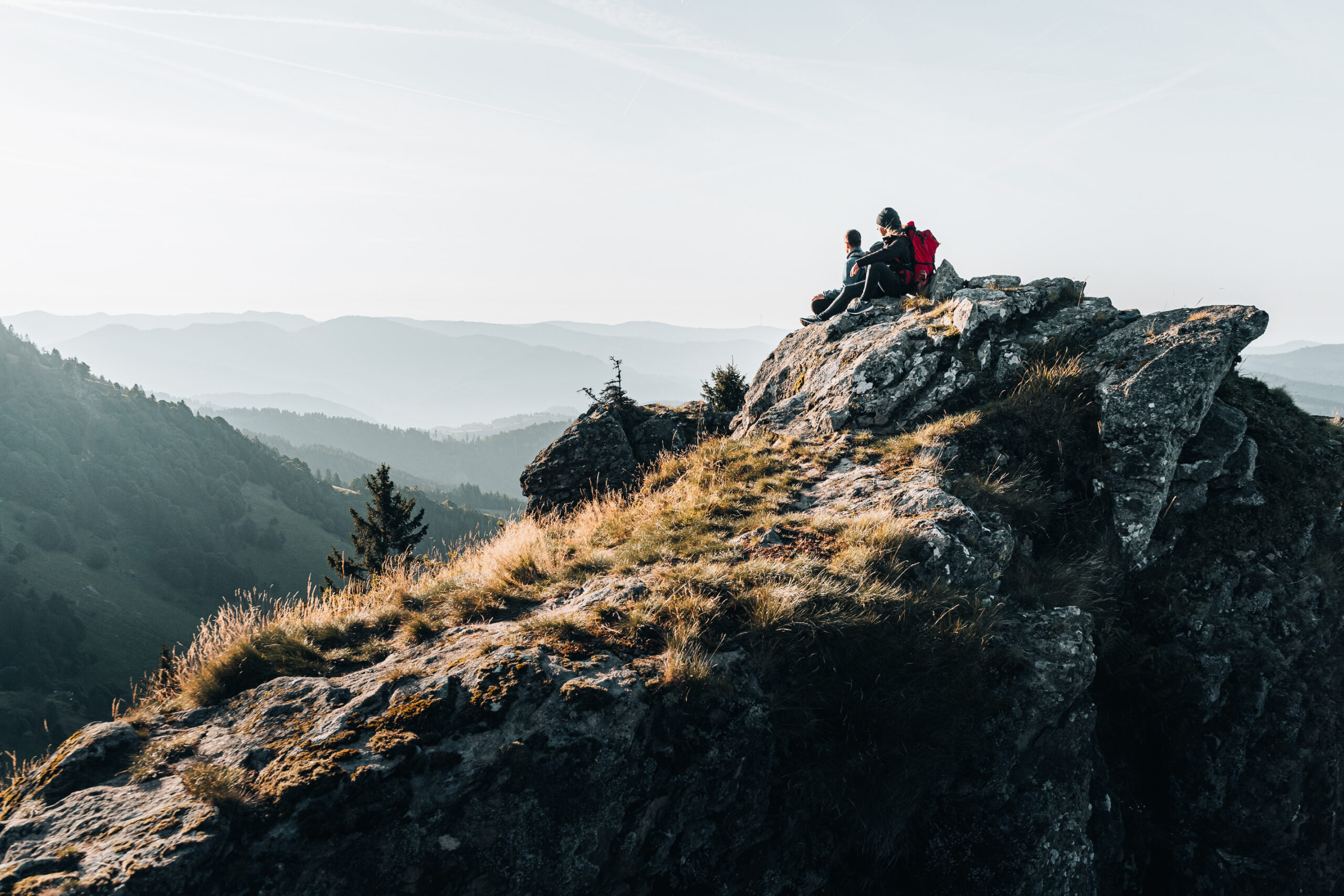 Hikers Sitting on Top of a Mountain