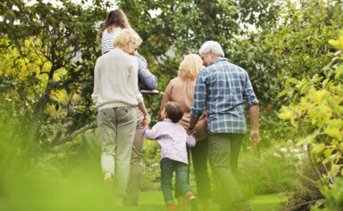 Family Walking Through Trees