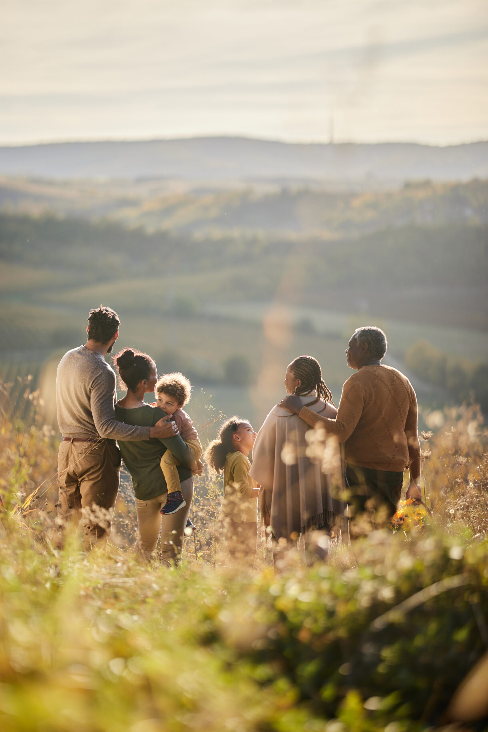 Family Standing in Meadow