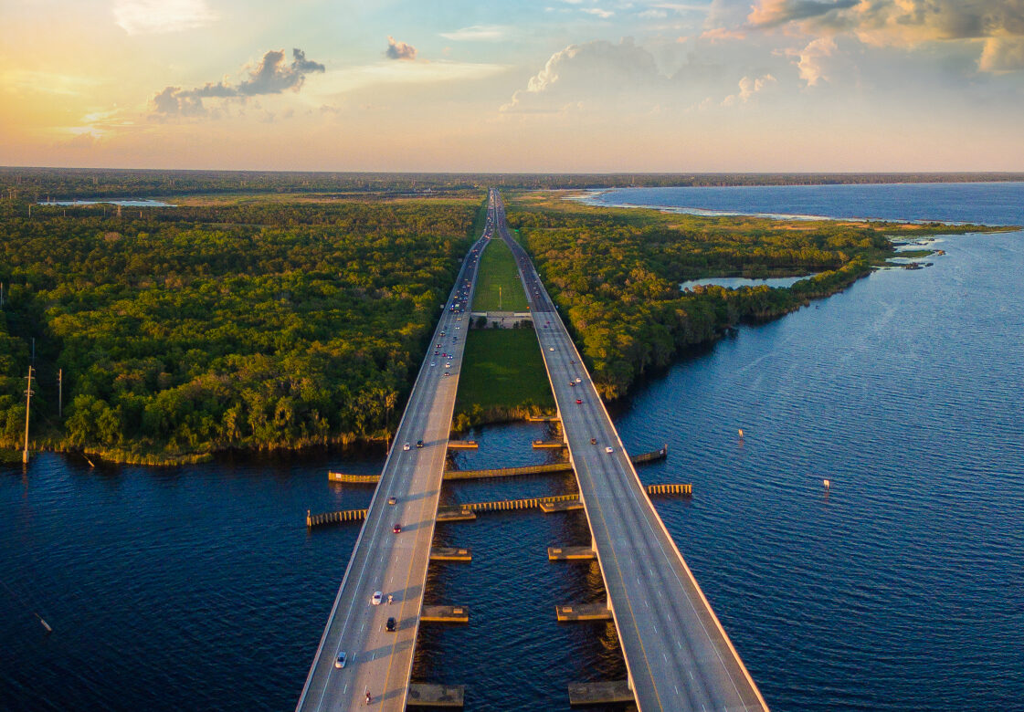 Cars Driving On a Bridge Over Water